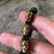 troc de troc bracelet têtes de mort métal doré ajustable image 1
