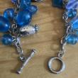 troc de troc bracelet à perles bleues et breloques image 2