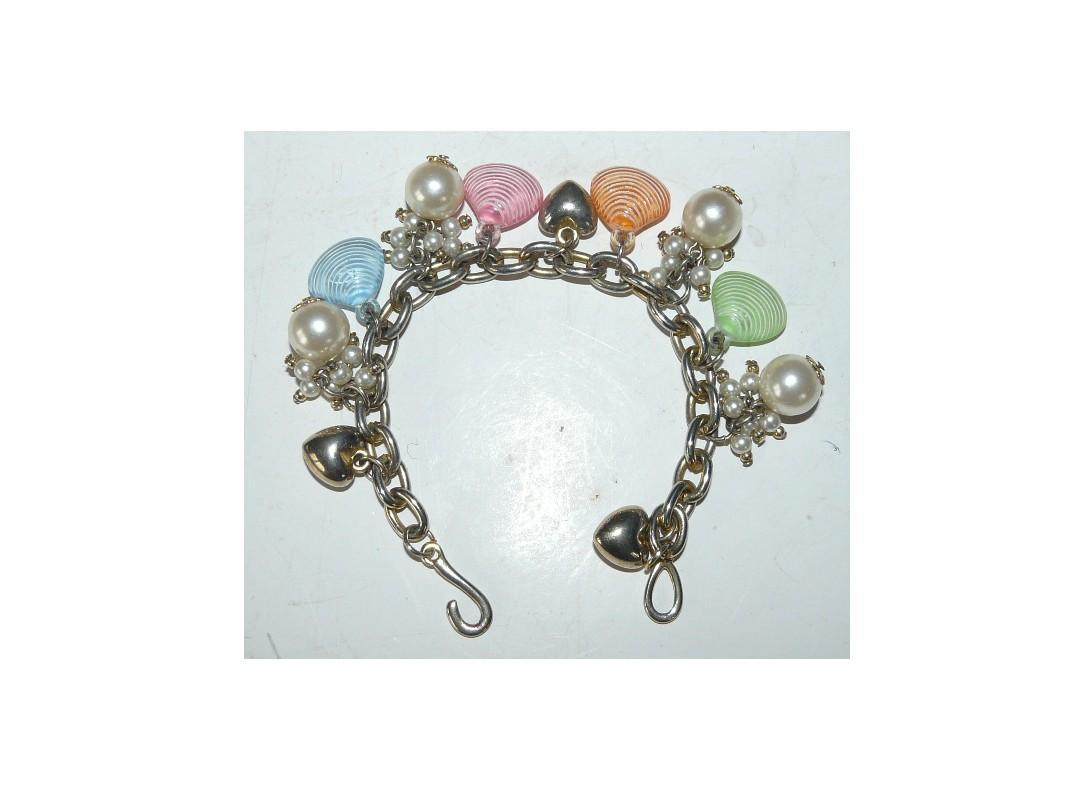 troc de troc réservé 10/11 à troqueuse - bracelet dorÉ avec coeurs, perles, coquillages image 0