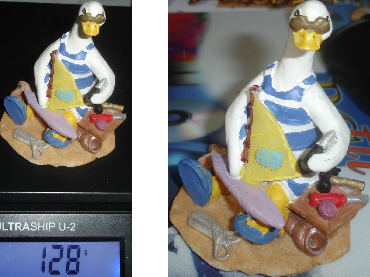 troc de troc oie pour collection : assise sur le sable avec voilier & outils image 1