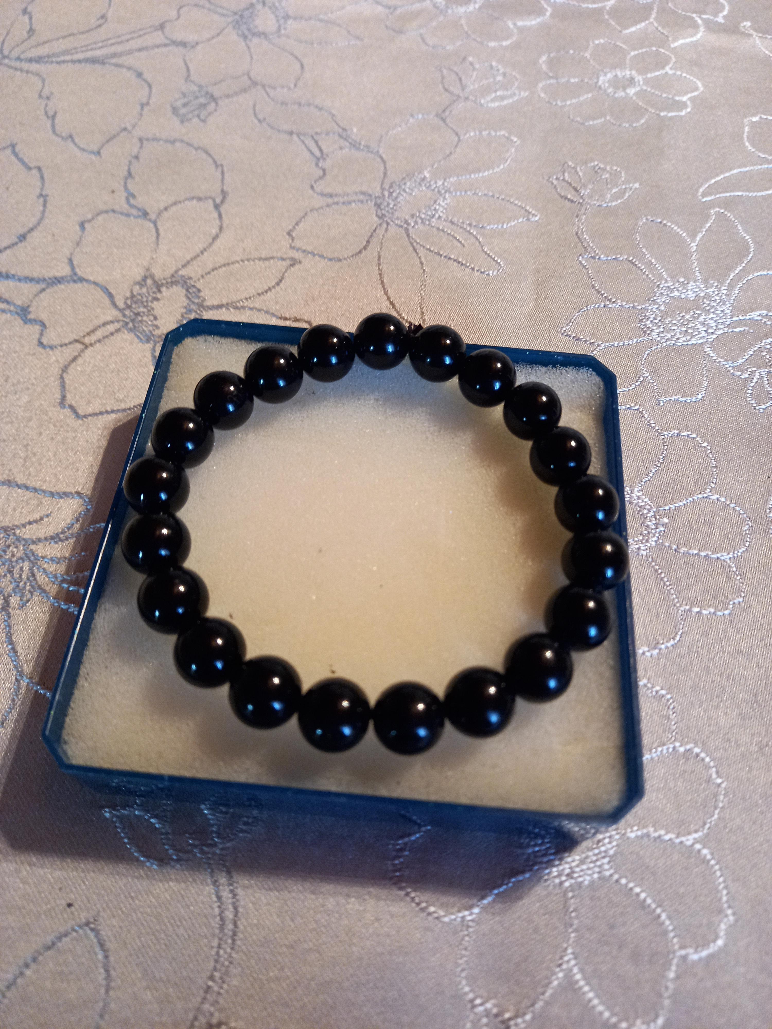 troc de troc bracelet à perles noires  reserve image 0
