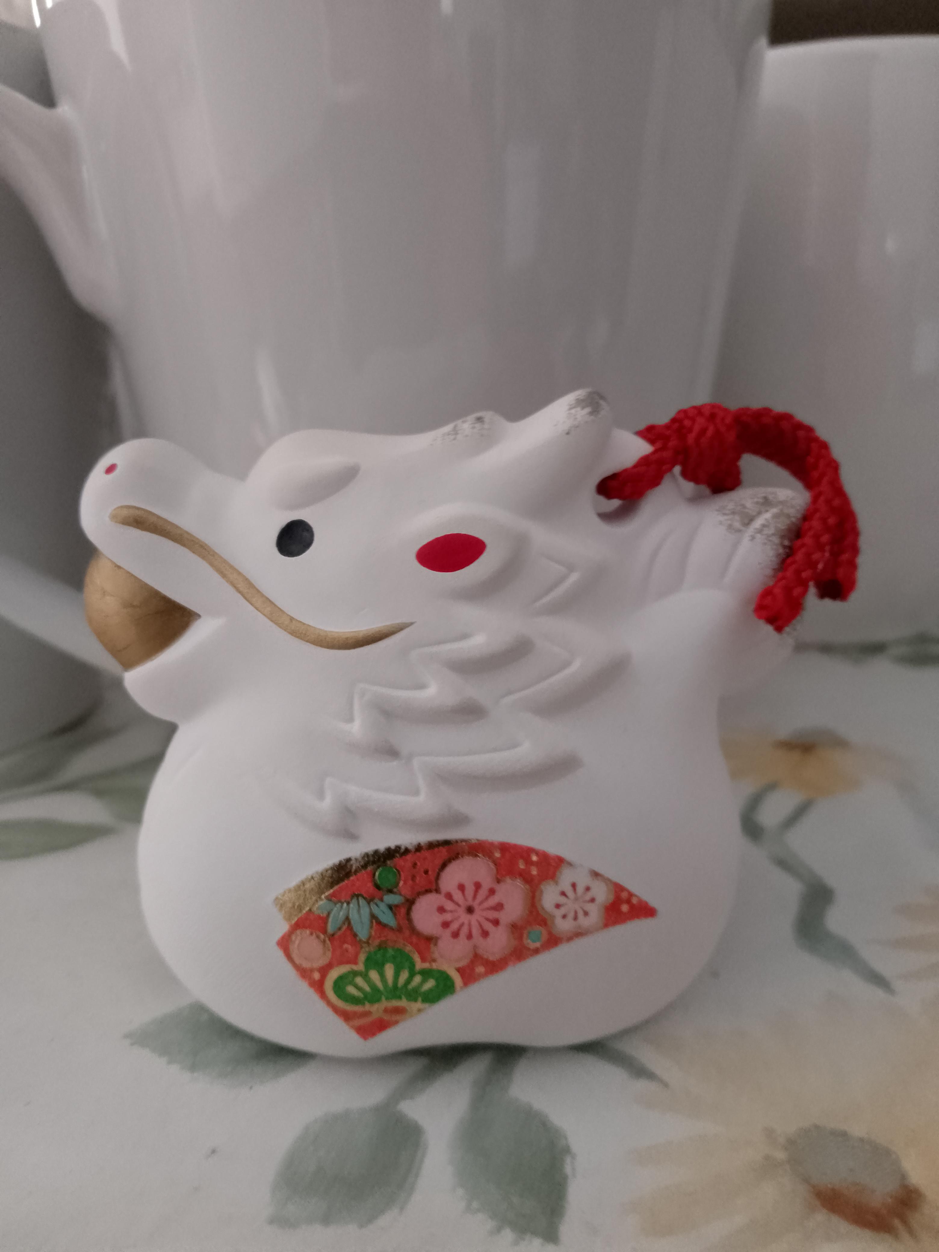 troc de troc dragon en porcelaine avec grelot image 0